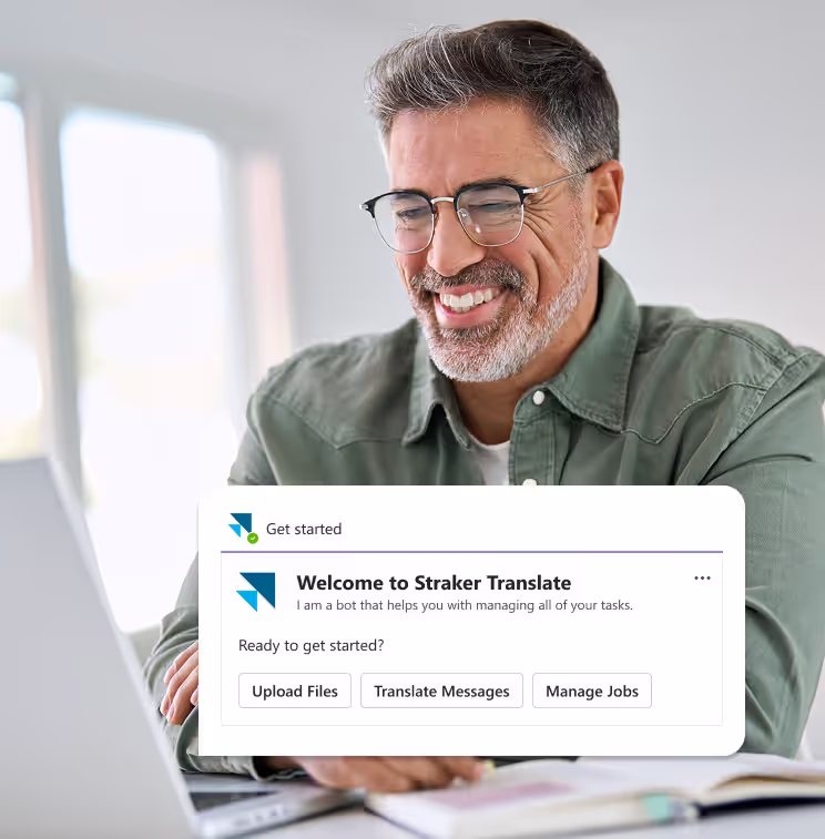 Smiling man receiving a Straker Translate notification in Microsoft Teams.